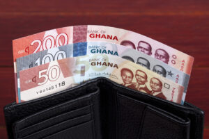 Ghanaian cedi in the black wallet